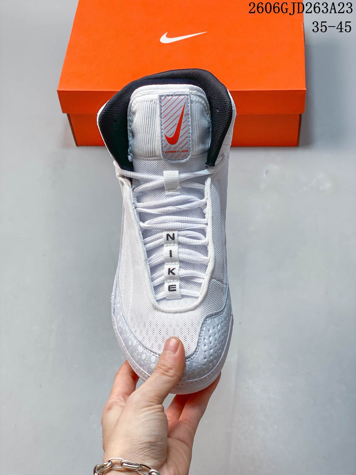 Front view of the shoe showing its laces, tongue and padded collar