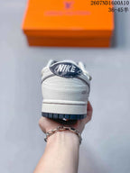 Rear view showing white heel panels, dark outsole edging, and Nike and Louis Vuitton branding details.