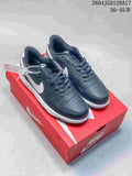 Pair of dark navy Nike Big Low low-top sneakers with white accents, shown on a red shoebox