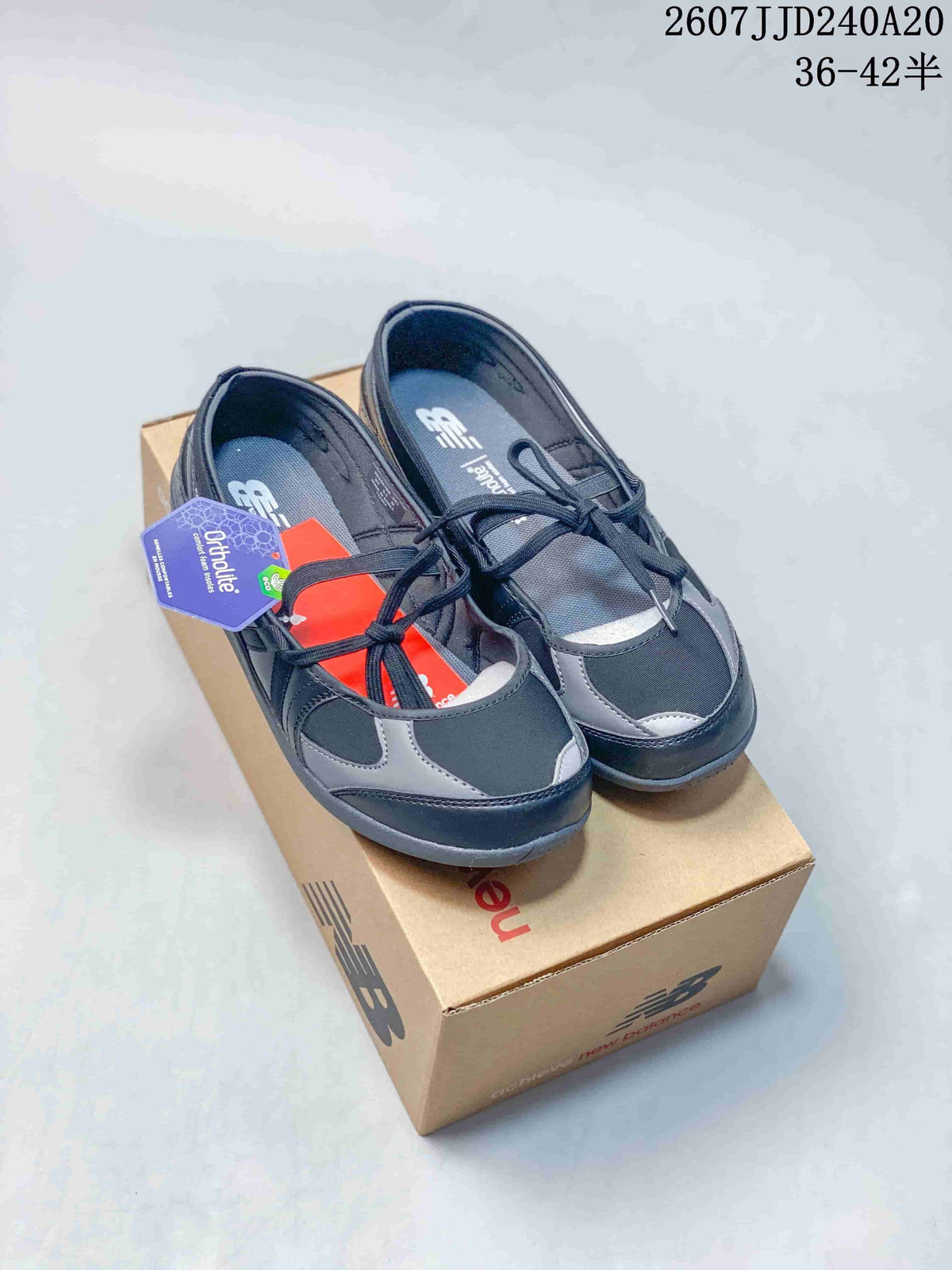 Black and grey New Balance Flat Breeze shoes shown from above with contrast panel detailing.