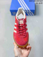 Top view showing red laces, white collar, tongue label and rounded toe.