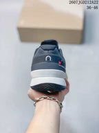 Rear view showing the padded heel, layered white midsole, dark outsole, and On branding.