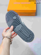 Close view of the dark textured outsole showing circular forefoot grooves and patterned tread.