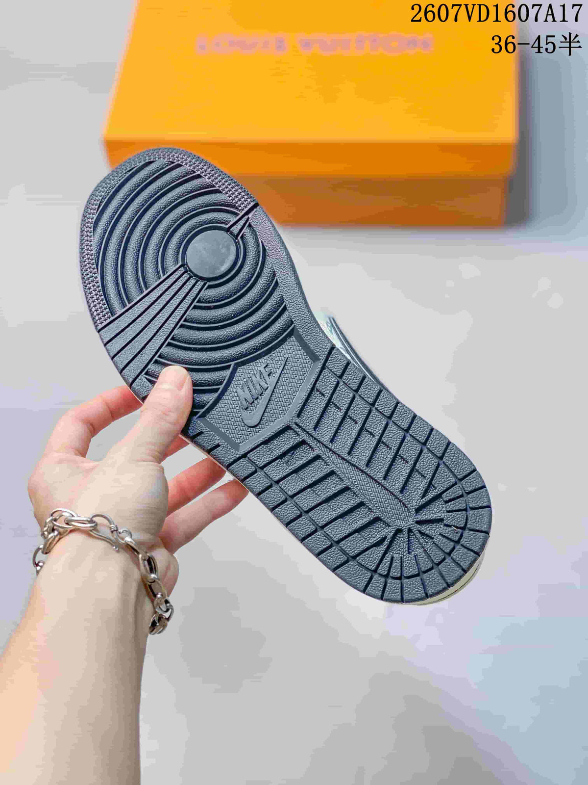 Close view of the dark textured outsole showing circular forefoot grooves and patterned tread.