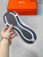 View of the black patterned outsole and white midsole