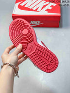 Red outsole with circular forefoot tread and rectangular heel tread