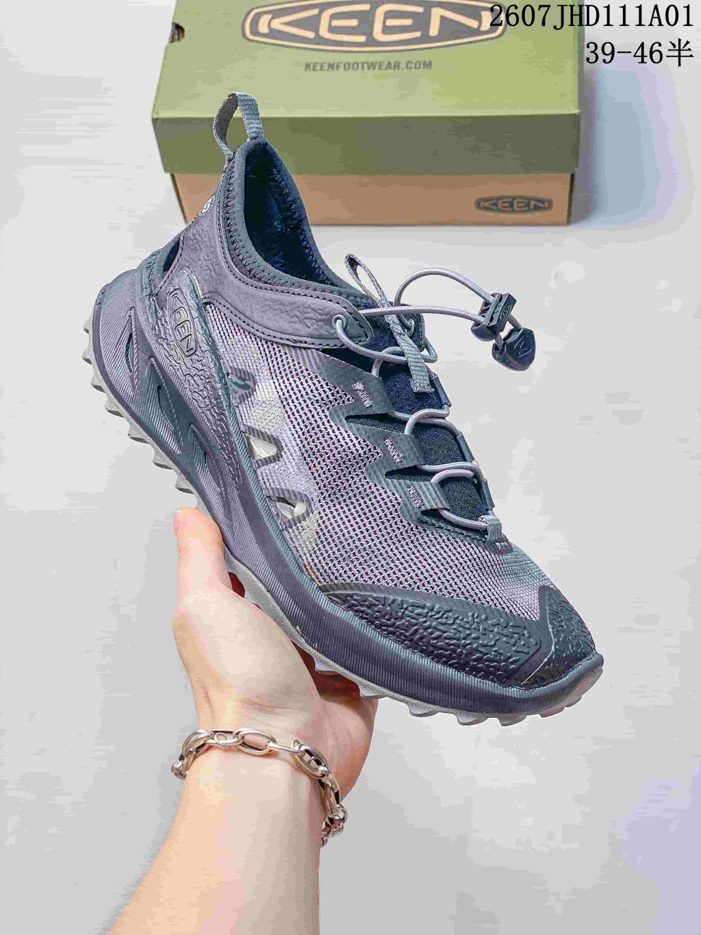 Angled side view of a gray Keen Zionic ADV shoe with mesh-look panels