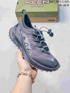Angled side view of a gray Keen Zionic ADV shoe with mesh-look panels