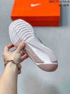 Underside view of the sneaker showing the segmented white outsole and traction pattern.