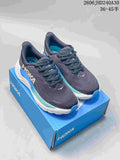 Pair of charcoal HOKA Arahi 8 running shoes with blue and aqua accents on a blue shoe box.