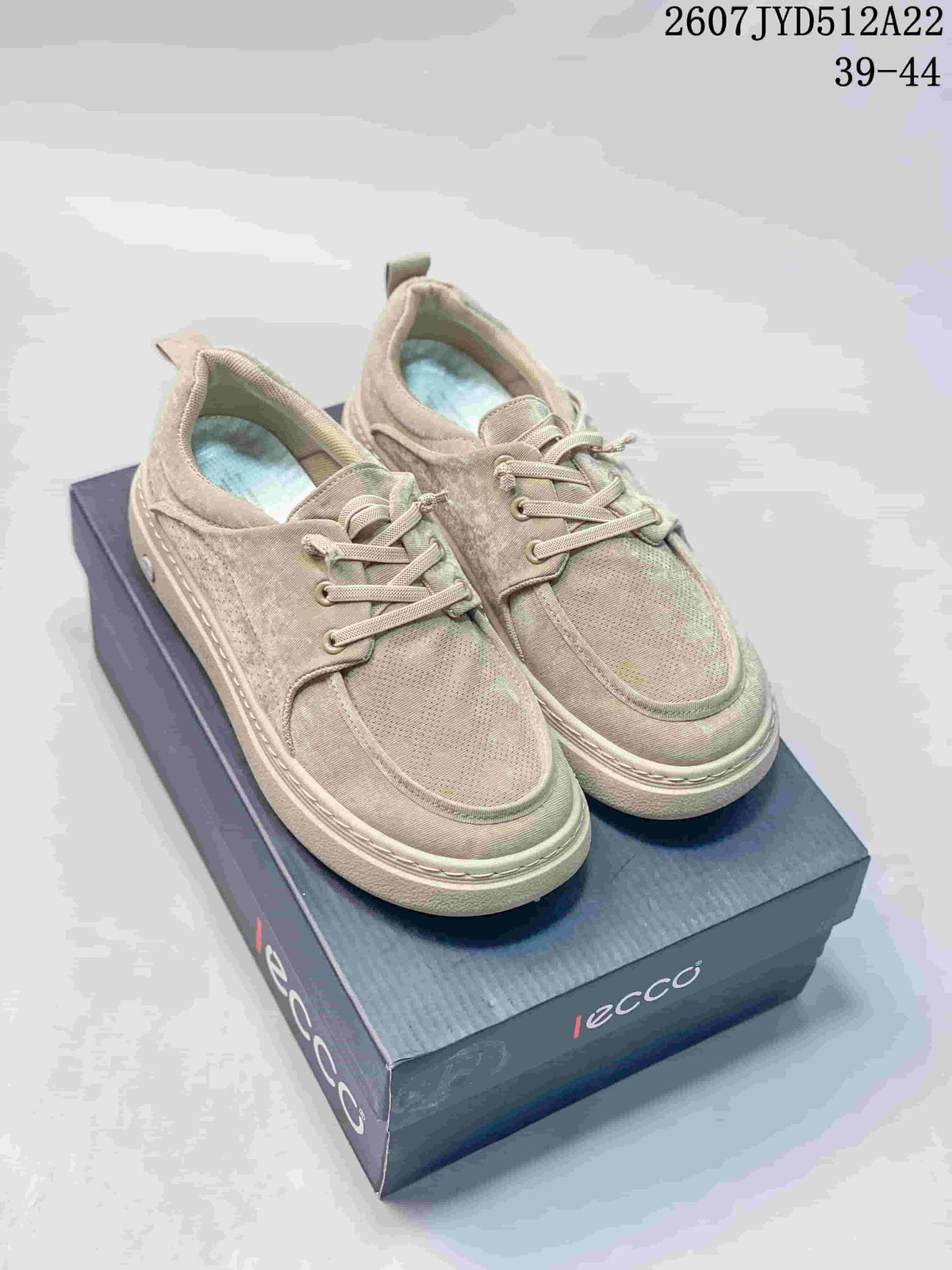Pair of beige ECCO sneakers displayed on a branded shoebox, with product code and EU size range visible at the top.