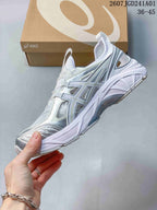 Side view of a white and silver ASICS GT-2160 Breeze sneaker with open side details.