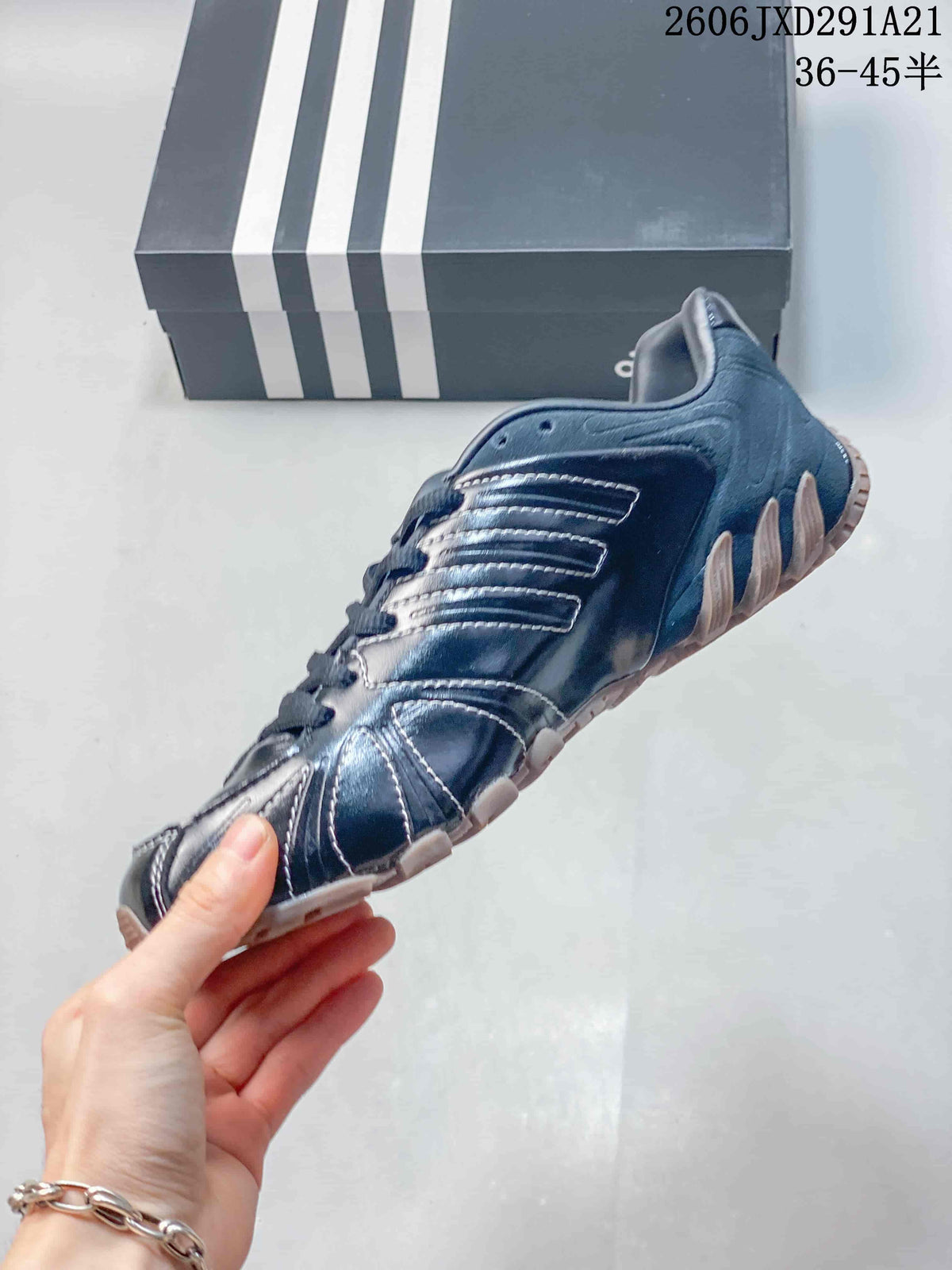 Side profile of a dark navy Ghost Sprint sneaker with contrasting stitching and tan outsole.