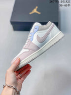 Side view showing the low-top profile, white base, pink overlays and light blue eyelet panel.