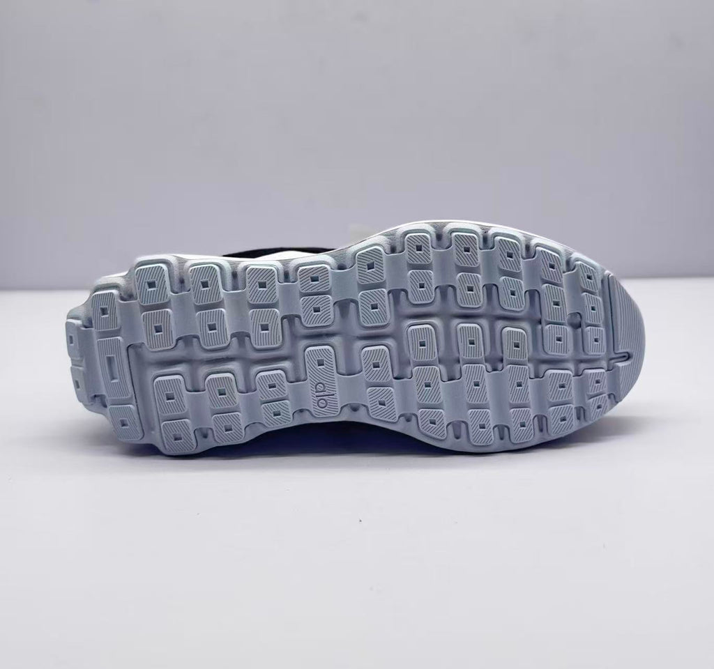 Bottom view showing the patterned rubber outsole with rectangular traction sections.