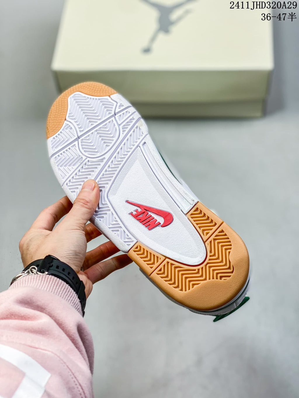 Underside of a sneaker showing a white and gum-colored patterned outsole with red Nike branding.