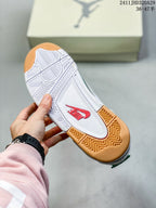 Underside of a sneaker showing a white and gum-colored patterned outsole with red Nike branding.