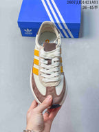 Top view showing the laces, toe panels, and yellow side stripes