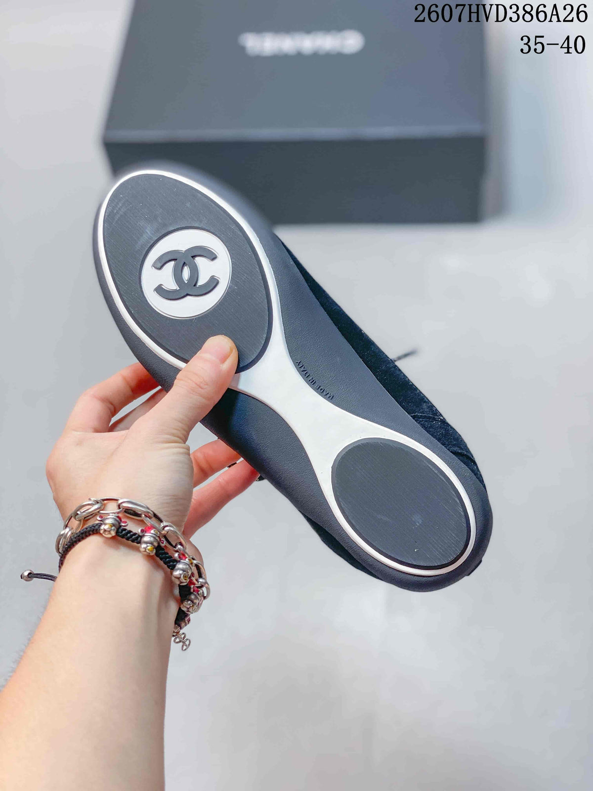 Close view of the sneaker outsole showing black and white sections and a circular branded heel detail.