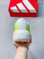 Rear view of the shoe highlighting the sculpted heel and neon-yellow side details.