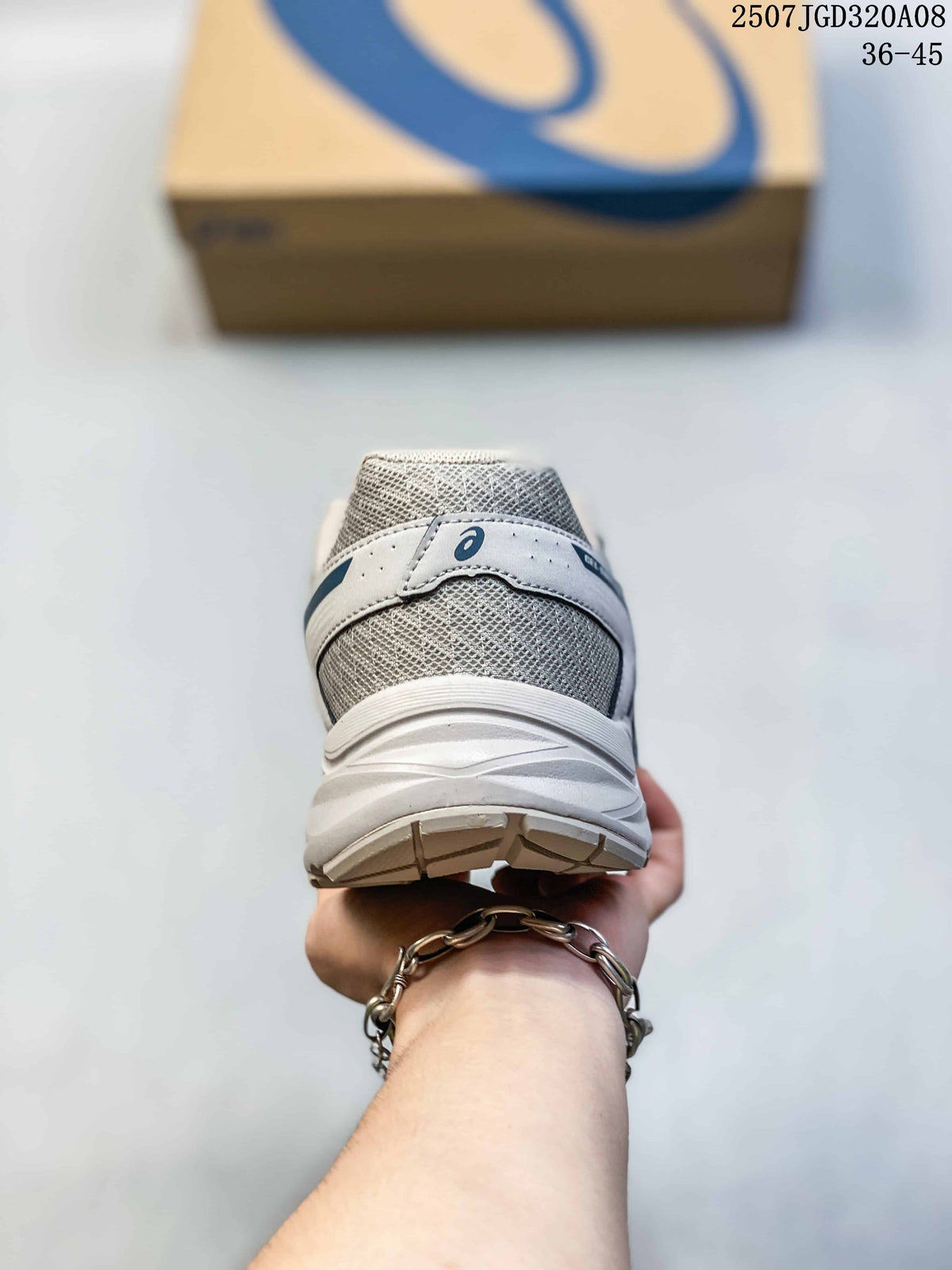 Rear view showing the padded heel, gray mesh panels and layered sole design.