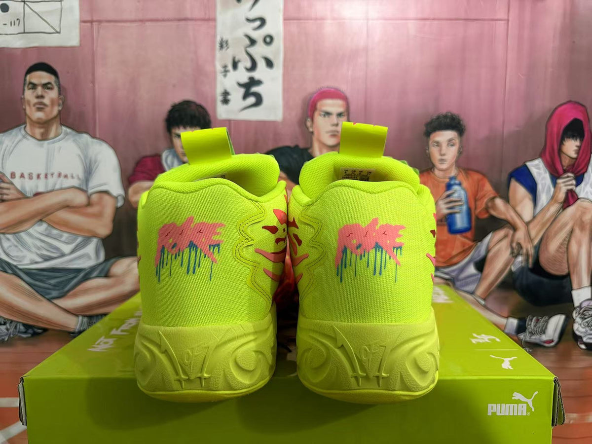 Rear view of lime green and coral PUMA basketball sneakers on a green shoe box.
