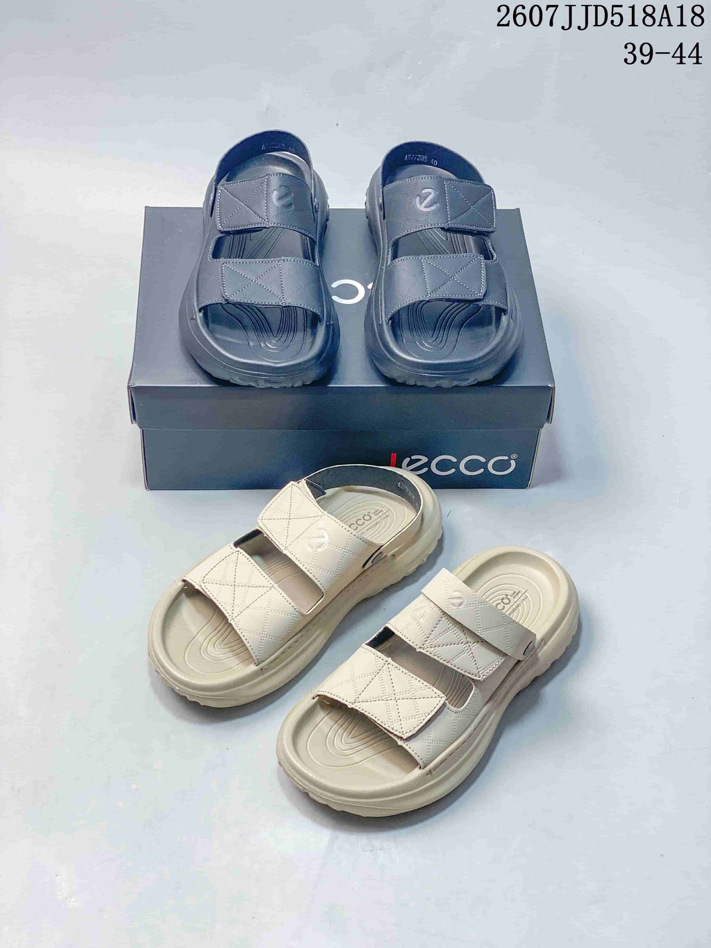 Black and cream ECCO sandals arranged together, showing the open-toe shape, dual straps, patterned uppers, and contoured footbeds.