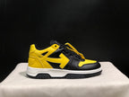 Full outer side profile showing the yellow heel, black upper panels, white midsole, and black outsole.