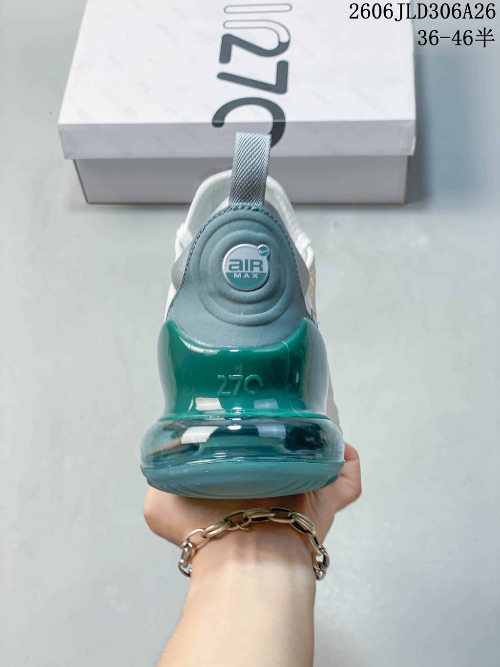 Rear view highlighting the teal heel unit and Air Max branding