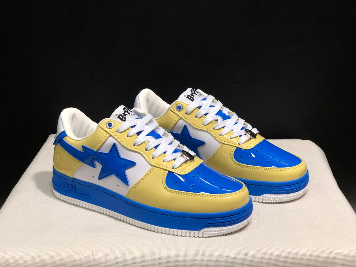 Pair of blue, yellow, and white BAPE STA low-top sneakers
