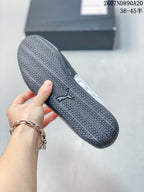 Close-up of the black textured outsole with directional tread and Puma logo