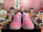 Front view of pink basketball shoes with pink laces and tongue details.