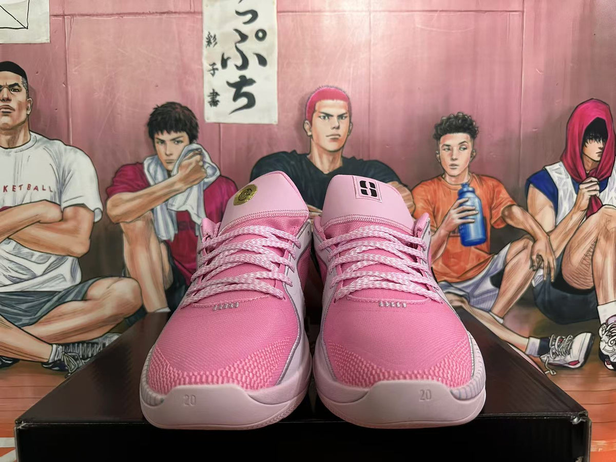 Front view of pink basketball shoes with pink laces and tongue details.