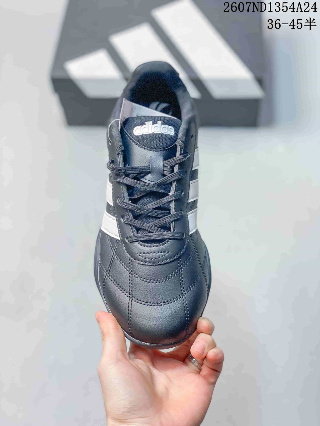 Front view showing the rounded toe, laces, tongue branding and stitched panels.