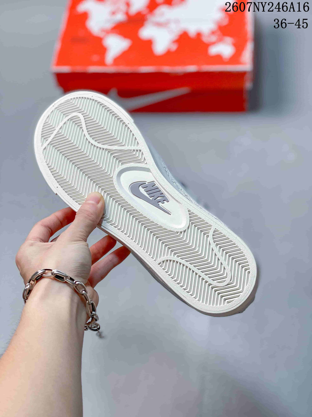 Close-up of the white outsole showing a herringbone-style tread and Nike branding.