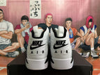 Rear view of white and black Jordan-style high-top sneakers showing heel branding.