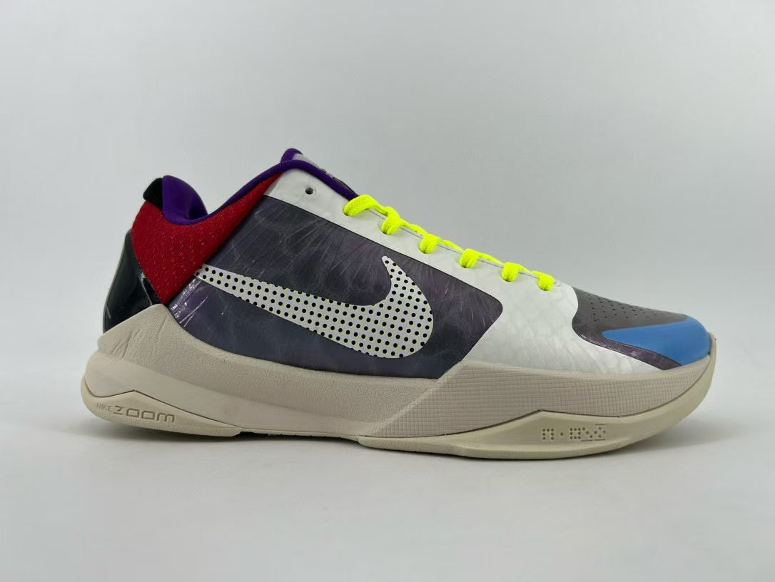 Side profile of the shoe with dotted logo and beige-colored sole