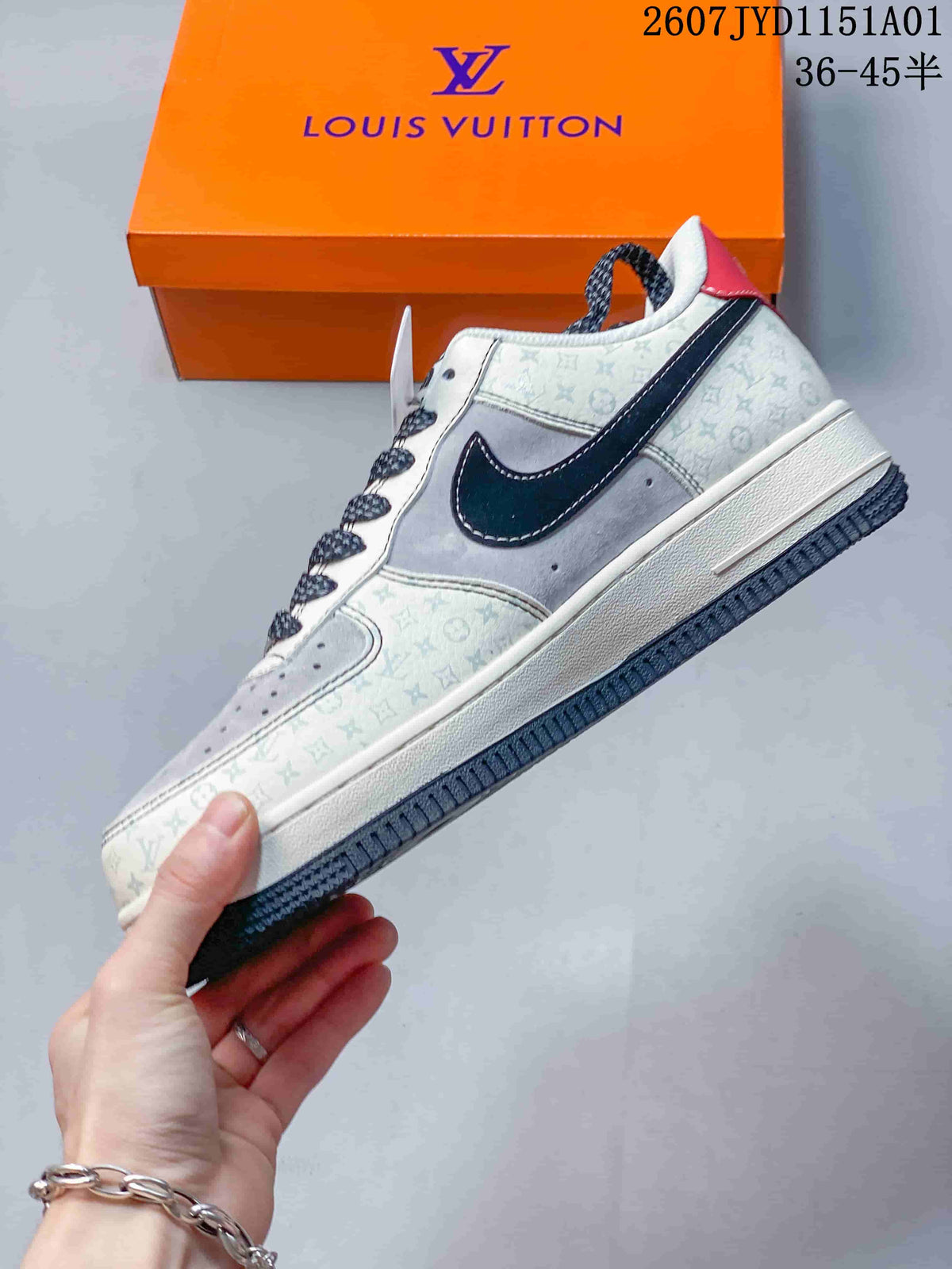 Side view of a low-top sneaker with cream and gray patterned panels, dark side detail, and dark outsole.