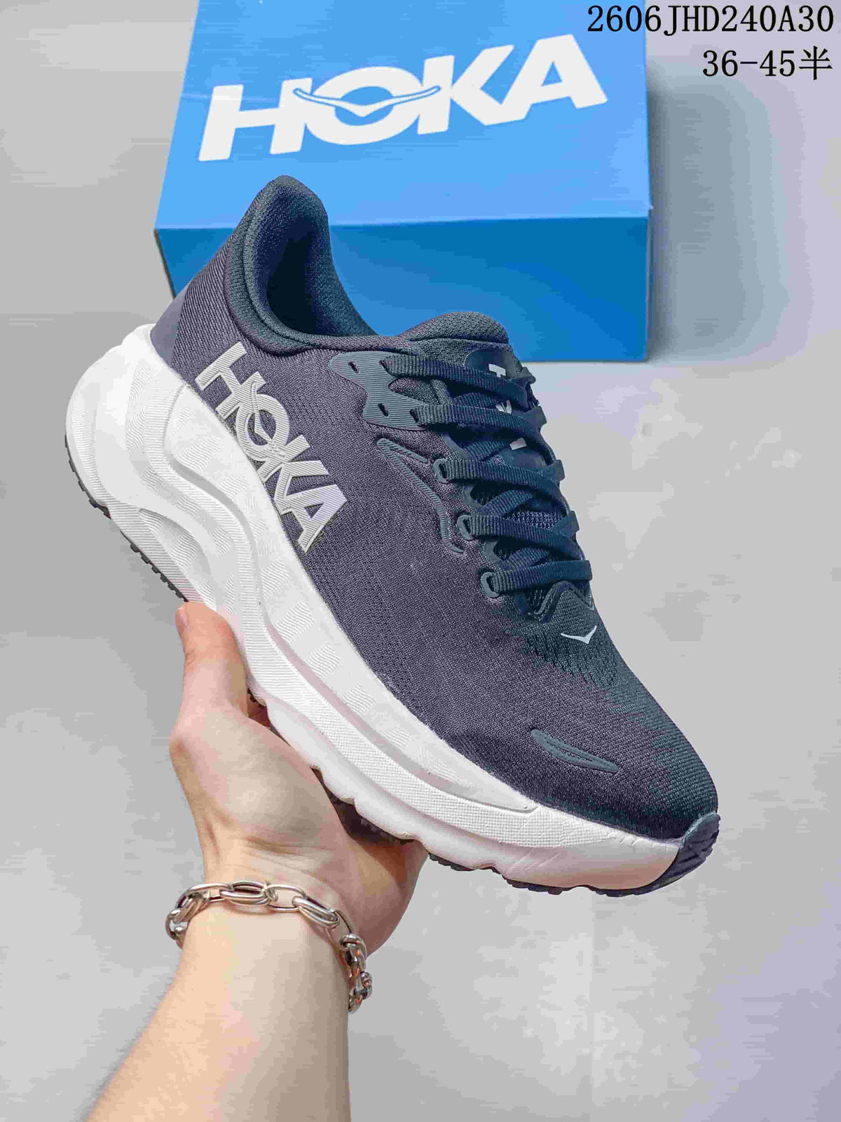 Dark blue HOKA Arahi 8 running shoe with a white sculpted sole.