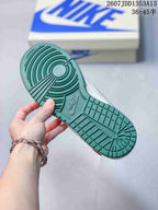 Close view of the green rubber outsole with circular traction grooves and molded branding.