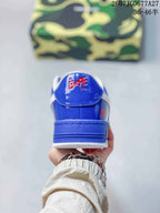 Rear view of a blue BAPE STA sneaker with a white padded collar and BAPE STA branding on the heel tab.