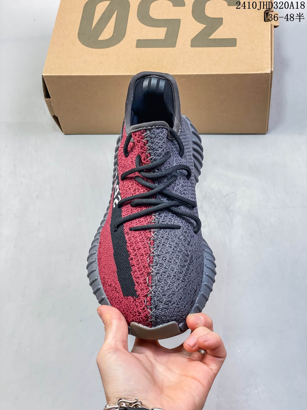 Top view of the sneaker showing the red and gray split-color upper, black laces, and contrasting black side stripe.