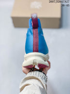 Rear view of a blue high-top sneaker showing the burgundy center heel pull tab and white sole.