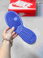Blue rubber outsole of the sneaker showing its circular forefoot and segmented tread pattern.