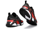 Rear and outsole views of black and red Jordan Heir shoes
