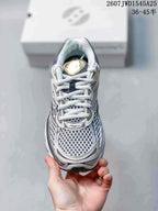Top view of the Saucony sneaker showing the white laces, padded collar and mesh-style toe area.