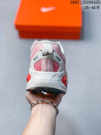 Rear view of a Nike Vomero 18 sneaker showing the padded heel, heel branding, and outsole edge.