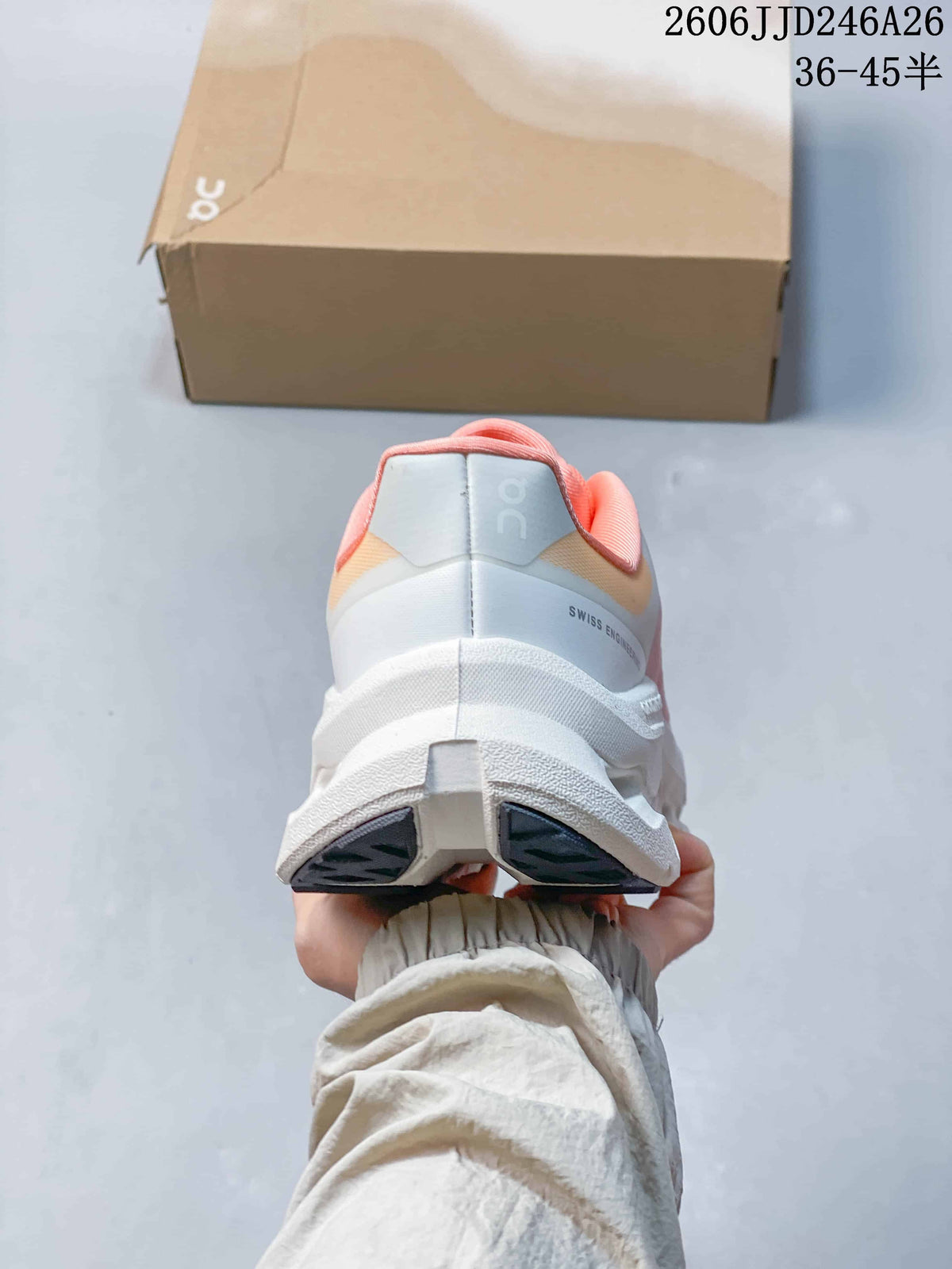 Rear view of the white and pink sneakers showing the padded heel and On branding.