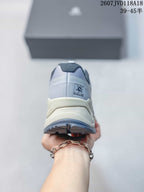 Rear view of the gray sneaker showing the KAILAS heel label, layered heel structure, and outsole tread.
