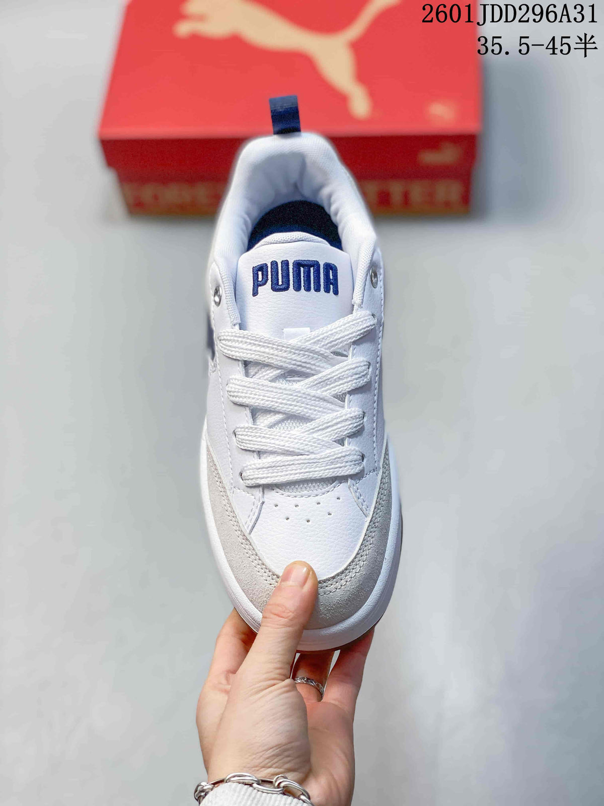 Top view showing the white laces, perforated toe area, padded collar, and PUMA tongue branding.